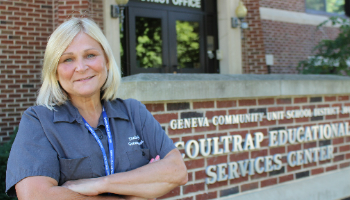 Audrey Bridges smiles in front of the Coultrap Educational Service Center.