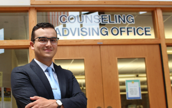 Mr Espana stands in front of counseling office