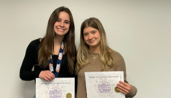 Women holding certificate