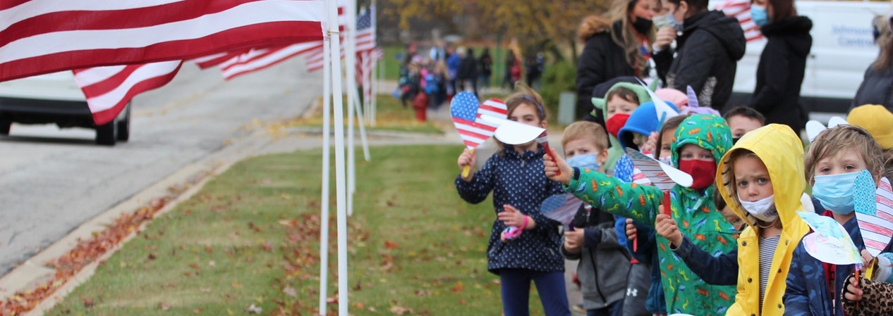 Kindergarten Students Cheer on Veterans