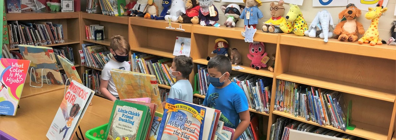 Students Choosing Books at Library