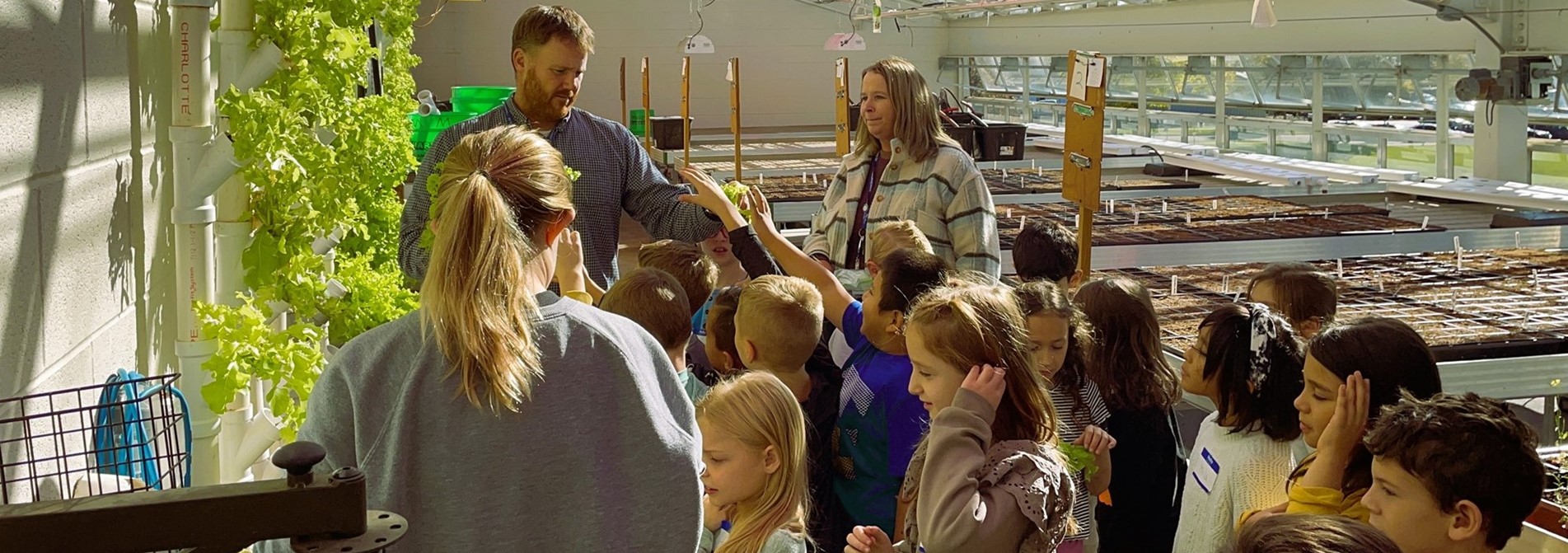 Harrison street school visits the green house at GHS