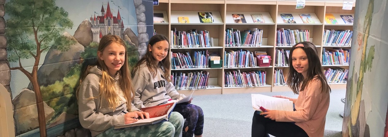 Heartland Students Reading in Library