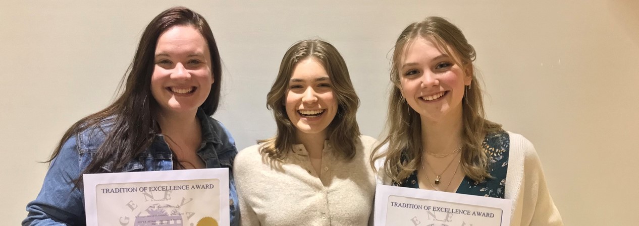 three female students receive the tradition of excellence award
