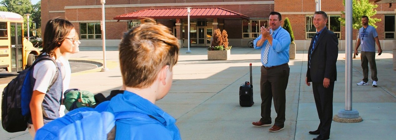 Principal welcomes students to Geneva Middle School North on the first day