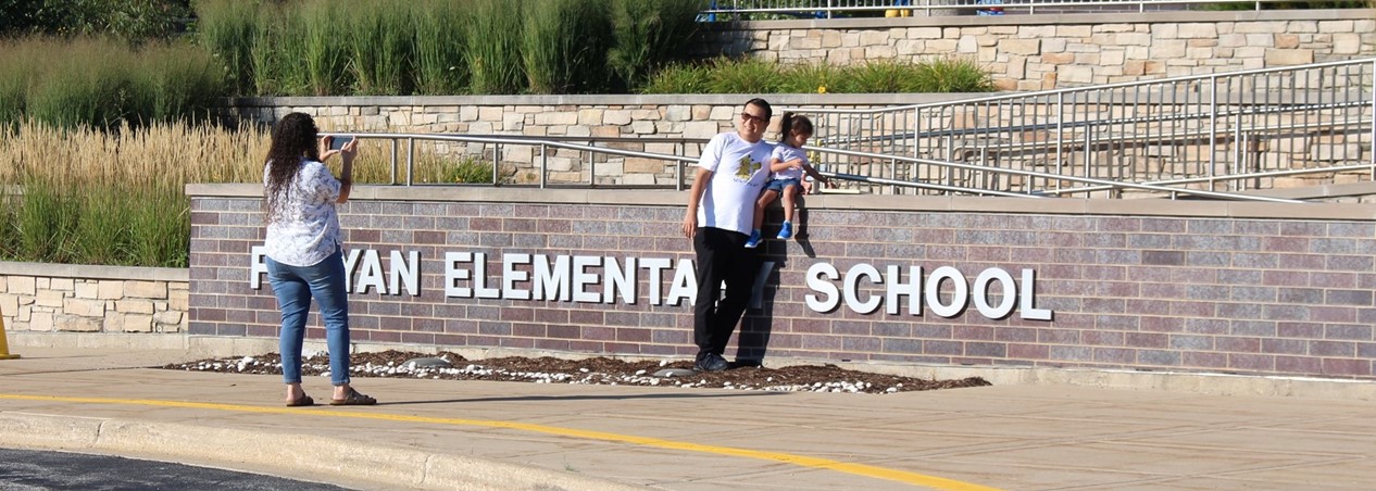 Taking pics in fron t of the sign